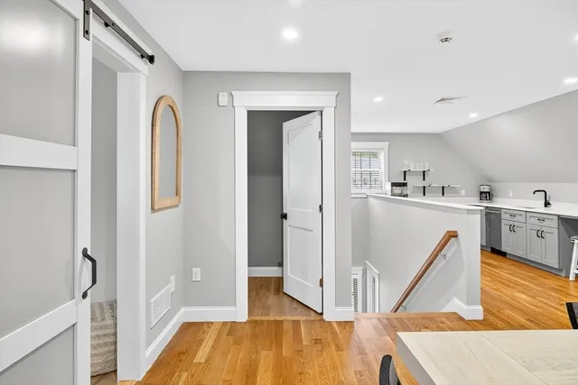 a view of kitchen with furniture and wooden floor