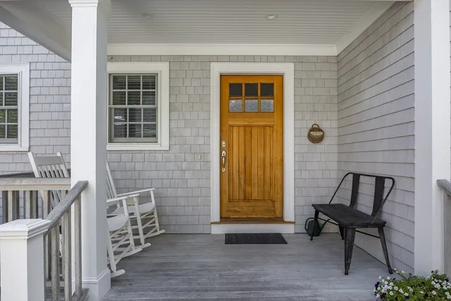 a view of front door of house with stairs