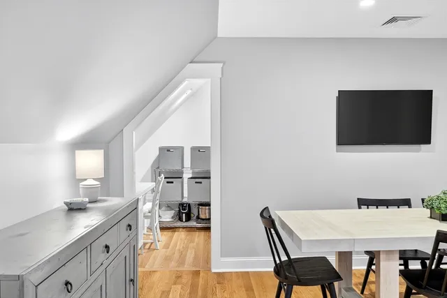 a view of a kitchen with a table and chairs