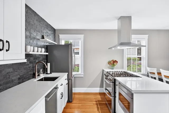 a kitchen with a sink stove and refrigerator