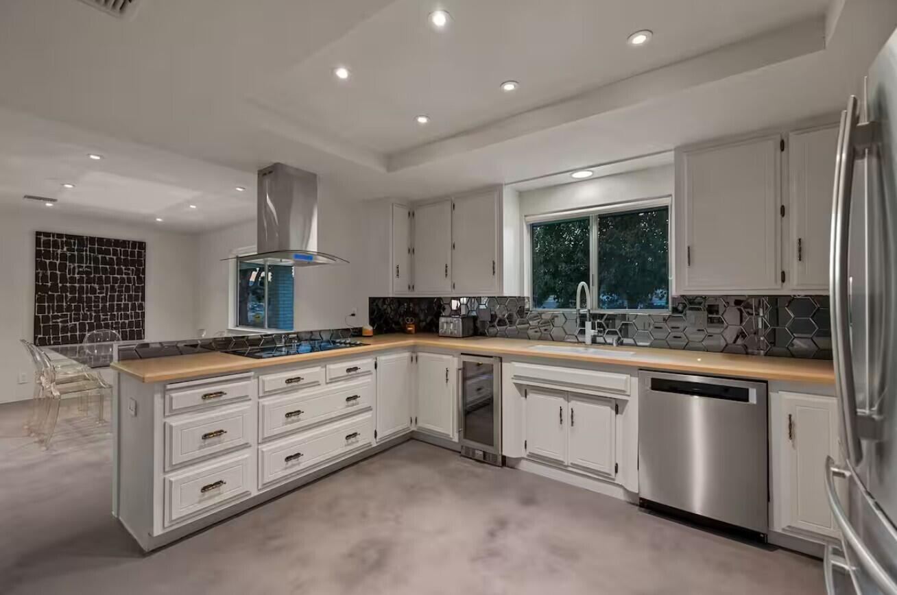 6451 Red Bluff Avenue Yucca Valley, CA 92284 - Photo 21 of 71 a kitchen with granite countertop a white stove and cabinets