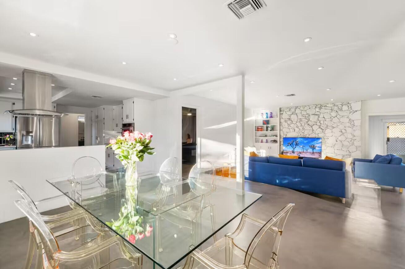 6451 Red Bluff Avenue Yucca Valley, CA 92284 - Photo 27 of 71 a dining room with furniture and a kitchen view