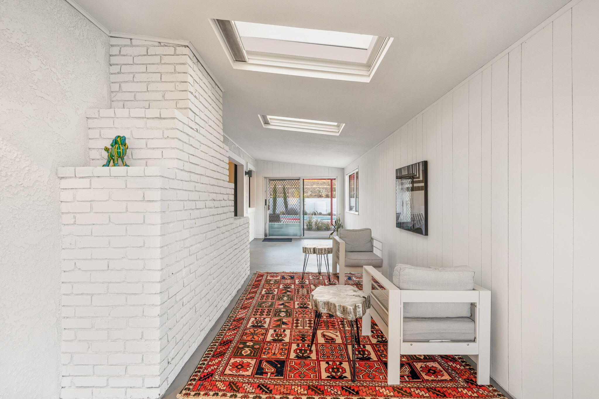 6451 Red Bluff Avenue Yucca Valley, CA 92284 - Photo 32 of 71 a living room with furniture and a rug