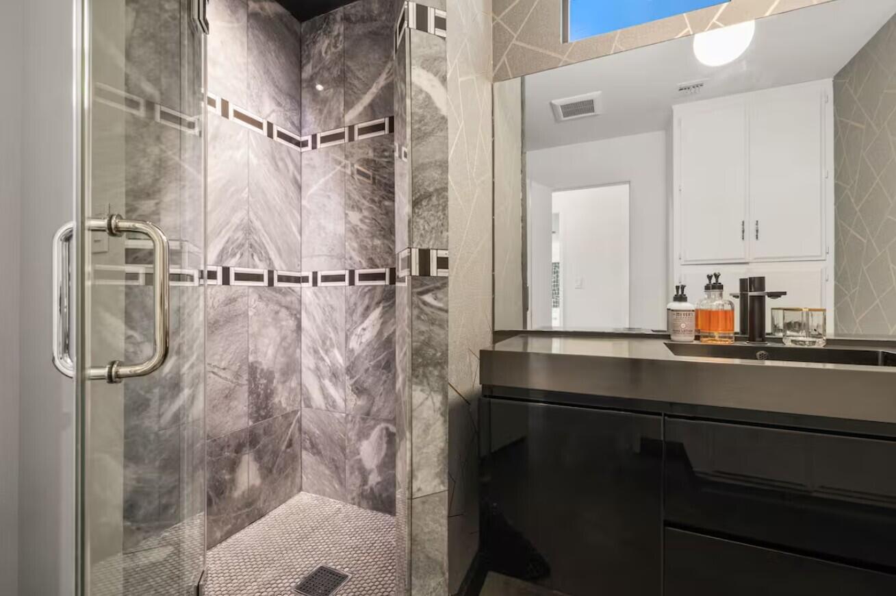 6451 Red Bluff Avenue Yucca Valley, CA 92284 - Photo 43 of 71 a bathroom with a sink vanity granite and shower