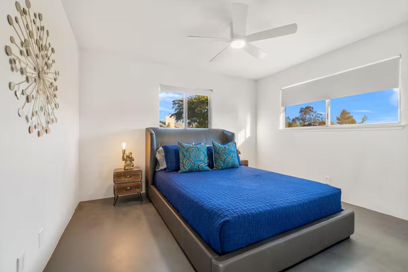 6451 Red Bluff Avenue Yucca Valley, CA 92284 - Photo 45 of 71 a bedroom with a bed and a painting on the wall