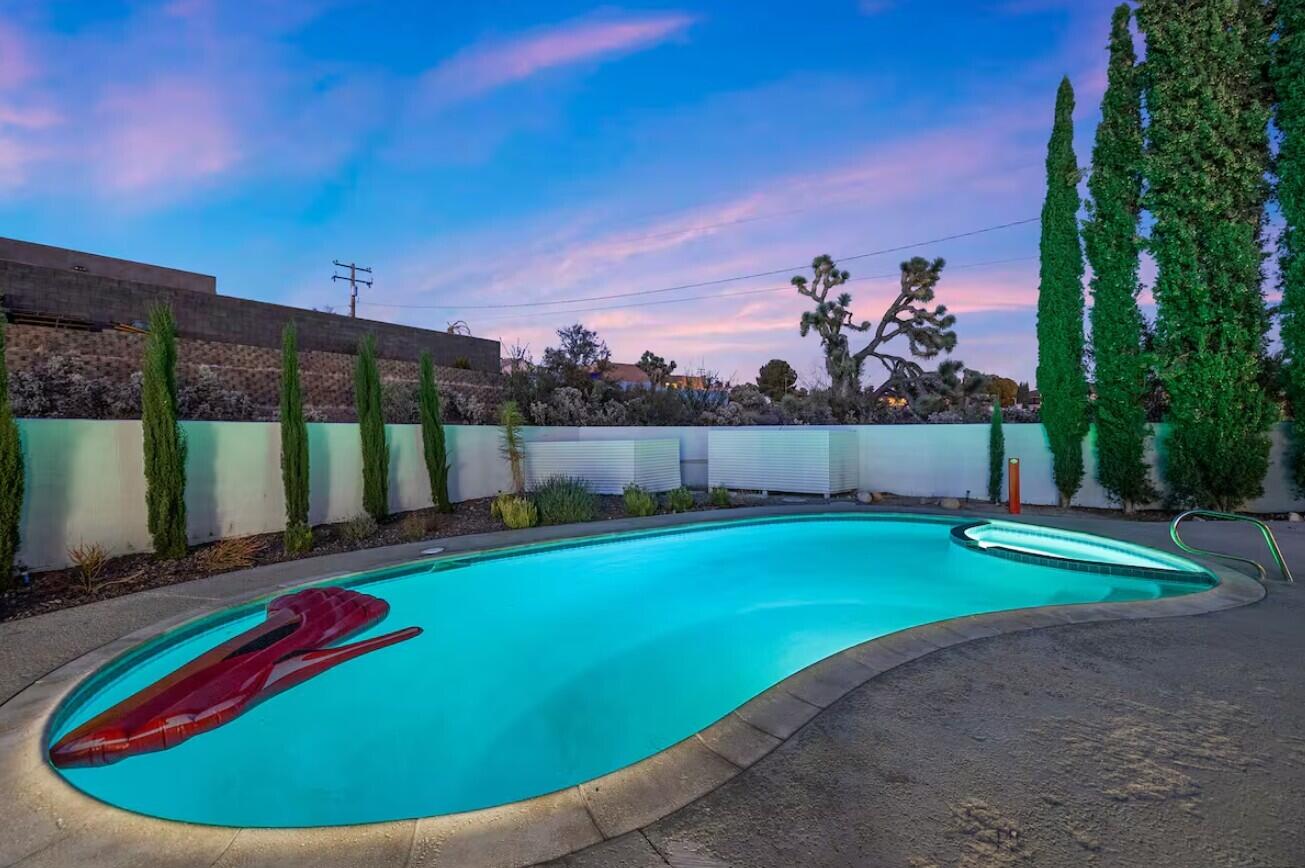 6451 Red Bluff Avenue Yucca Valley, CA 92284 - Photo 52 of 71 a view of a backyard with a swimming pool