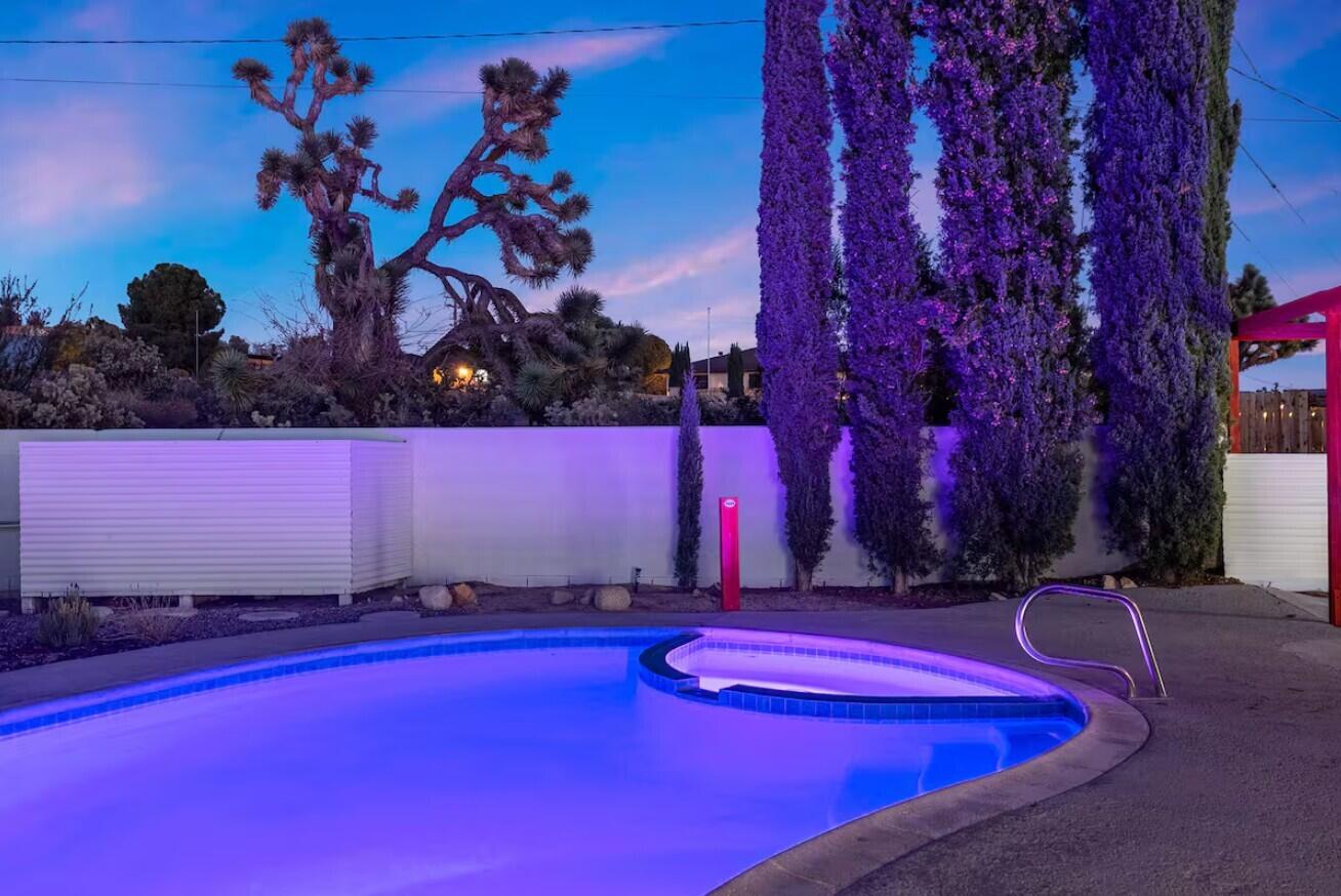 6451 Red Bluff Avenue Yucca Valley, CA 92284 - Photo 54 of 71 a view of a pool with a table and chairs