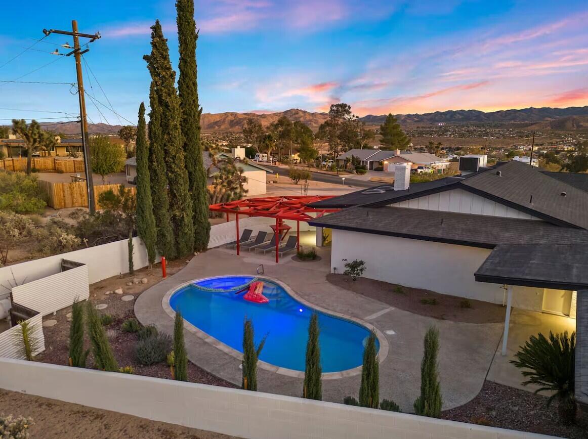 6451 Red Bluff Avenue Yucca Valley, CA 92284 - Photo 55 of 71 a view of a balcony with chair and wooden floor