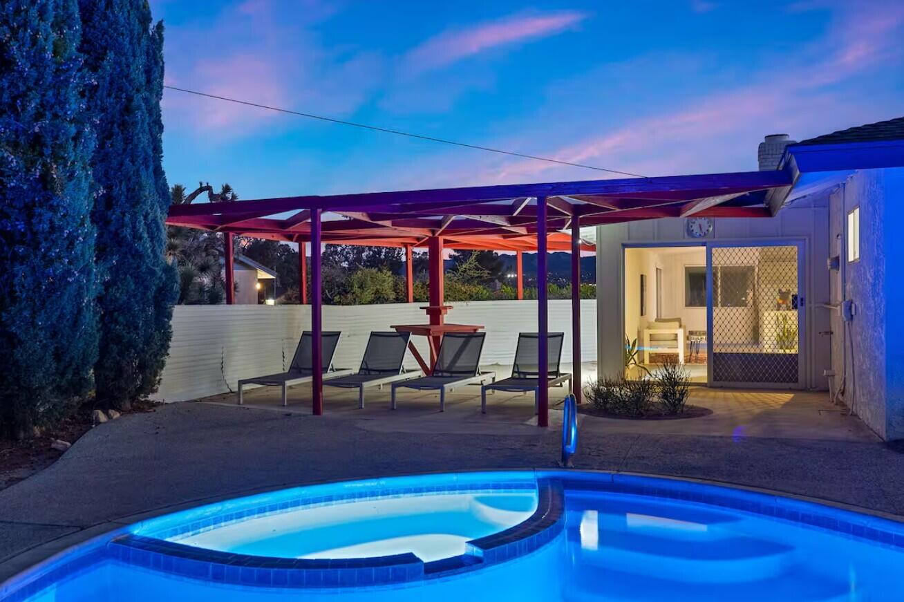 6451 Red Bluff Avenue Yucca Valley, CA 92284 - Photo 65 of 71 a view of a patio with a table and chairs