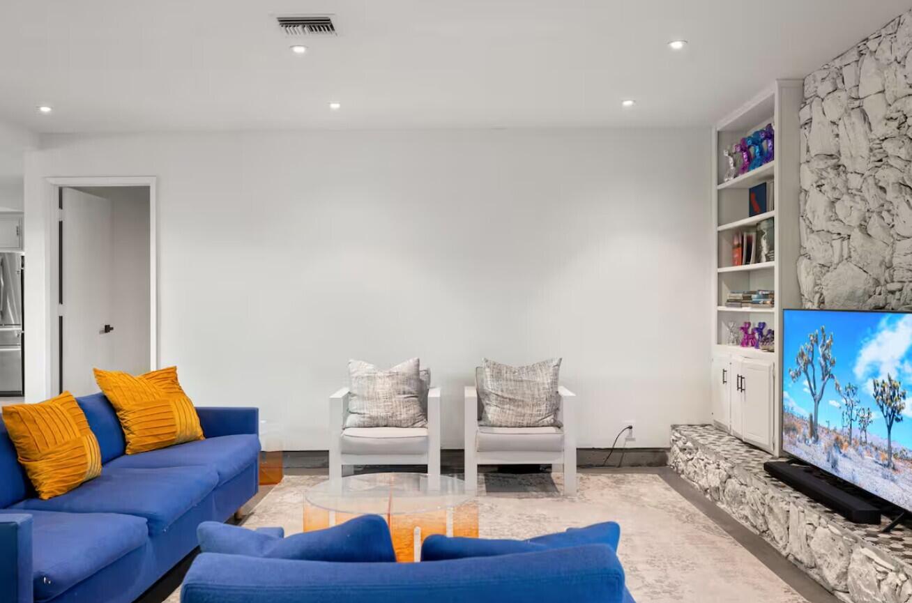 6451 Red Bluff Avenue Yucca Valley, CA 92284 - Photo 8 of 71 a living room with furniture and a flat screen tv