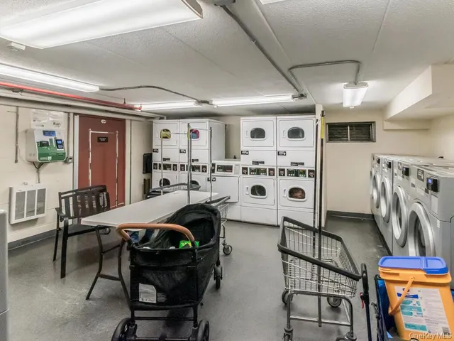 a bedroom with furniture and a large window