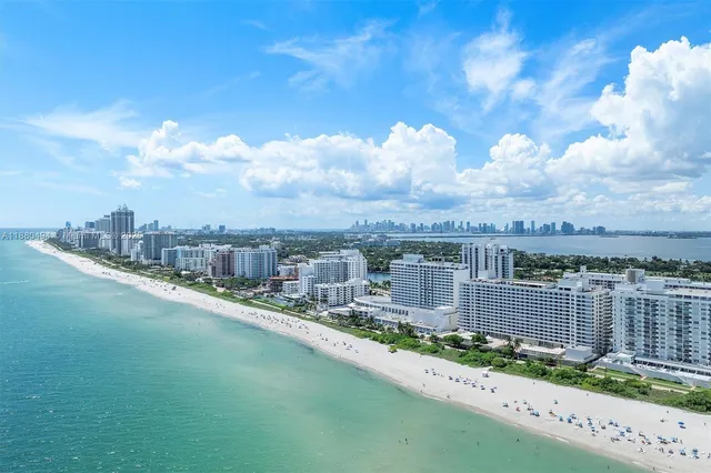 a view of a swimming pool with outdoor seating