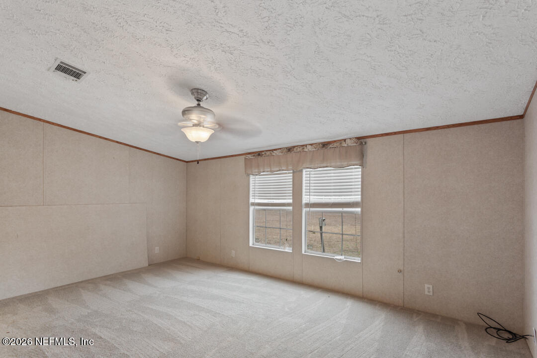5316 Carter Spencer Road Middleburg, FL 32068 - Photo 9 of 19 a view of an empty room with a window
