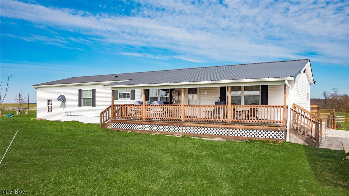 66092 Pisgah Road Quaker City, OH 43773 - Photo 20 of 28 Rear view of house with a yard and a deck