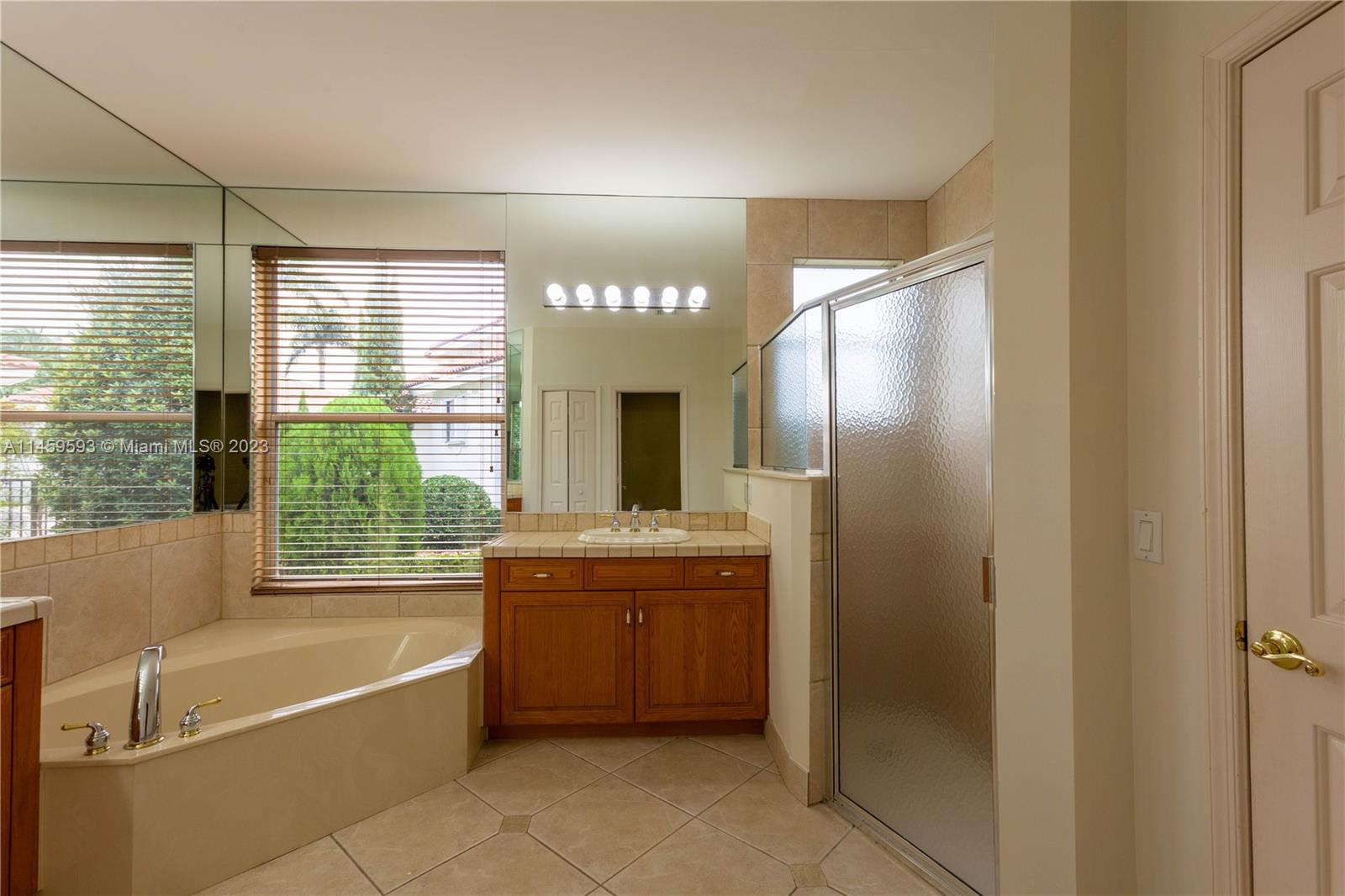 Sunset Lakes Miramar, FL 33029 - Photo 12 of 51 a bathroom with a bathtub and a sink