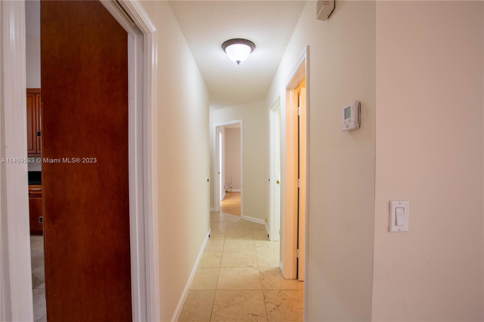 Sunset Lakes Miramar, FL 33029 - Photo 16 of 51 a view of a bathroom from a hallway