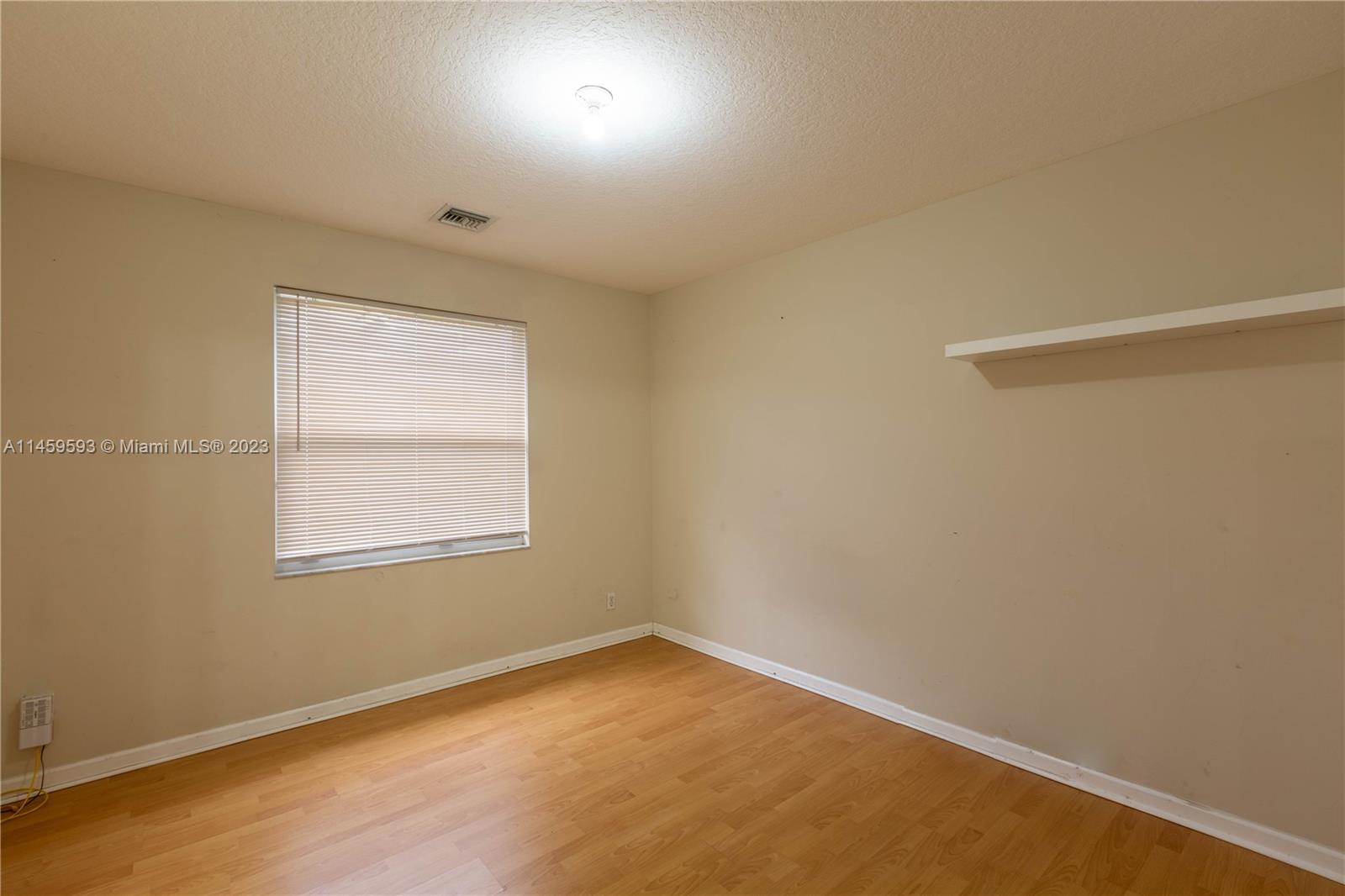 Sunset Lakes Miramar, FL 33029 - Photo 18 of 51 an empty room with a window