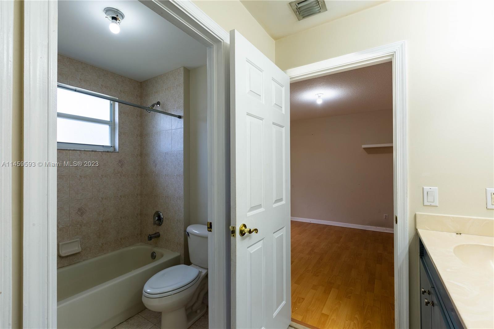 Sunset Lakes Miramar, FL 33029 - Photo 23 of 51 a bathroom with a shower and a toilet