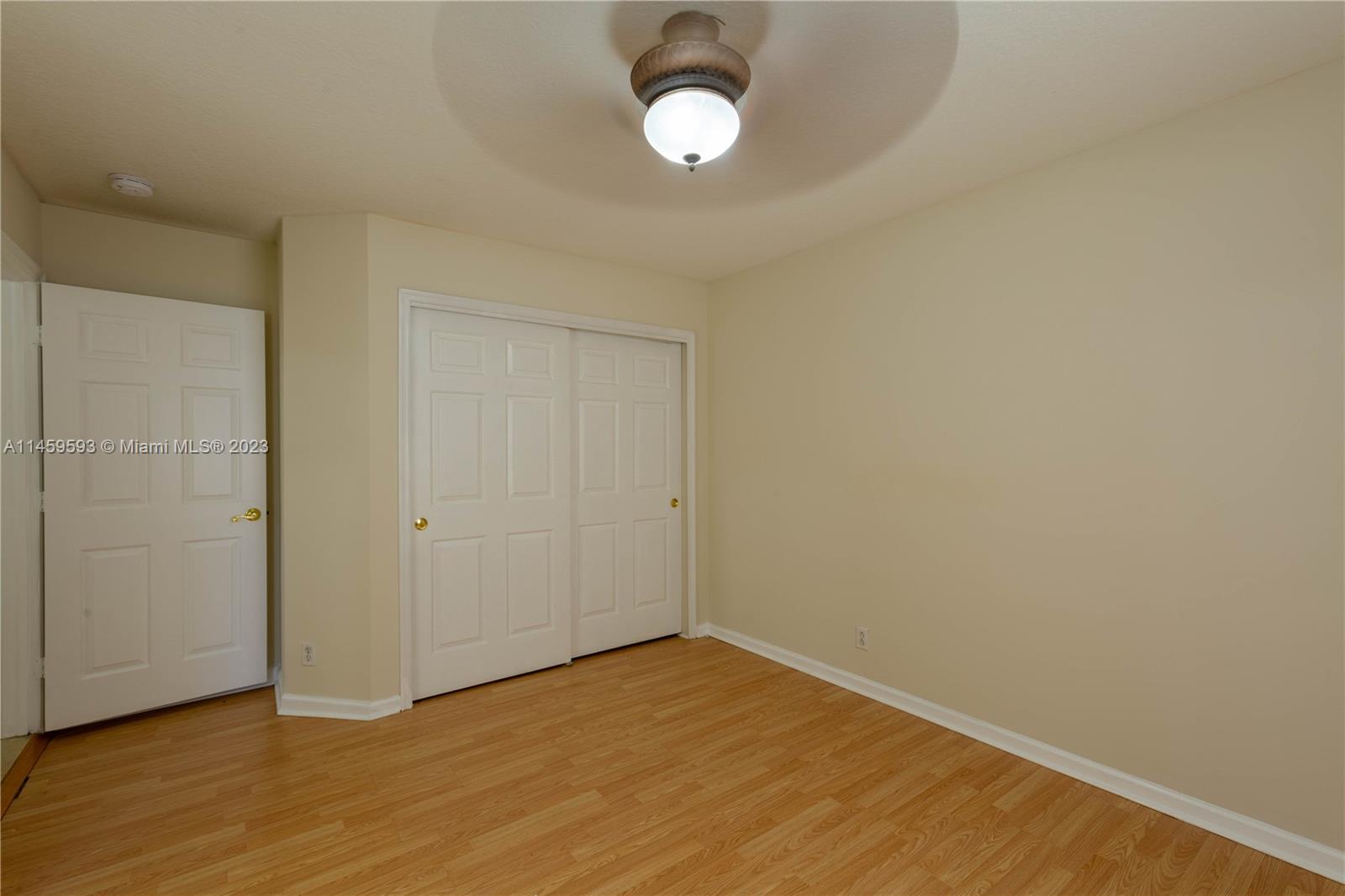 Sunset Lakes Miramar, FL 33029 - Photo 25 of 51 a view of an empty room with wooden floor and a window