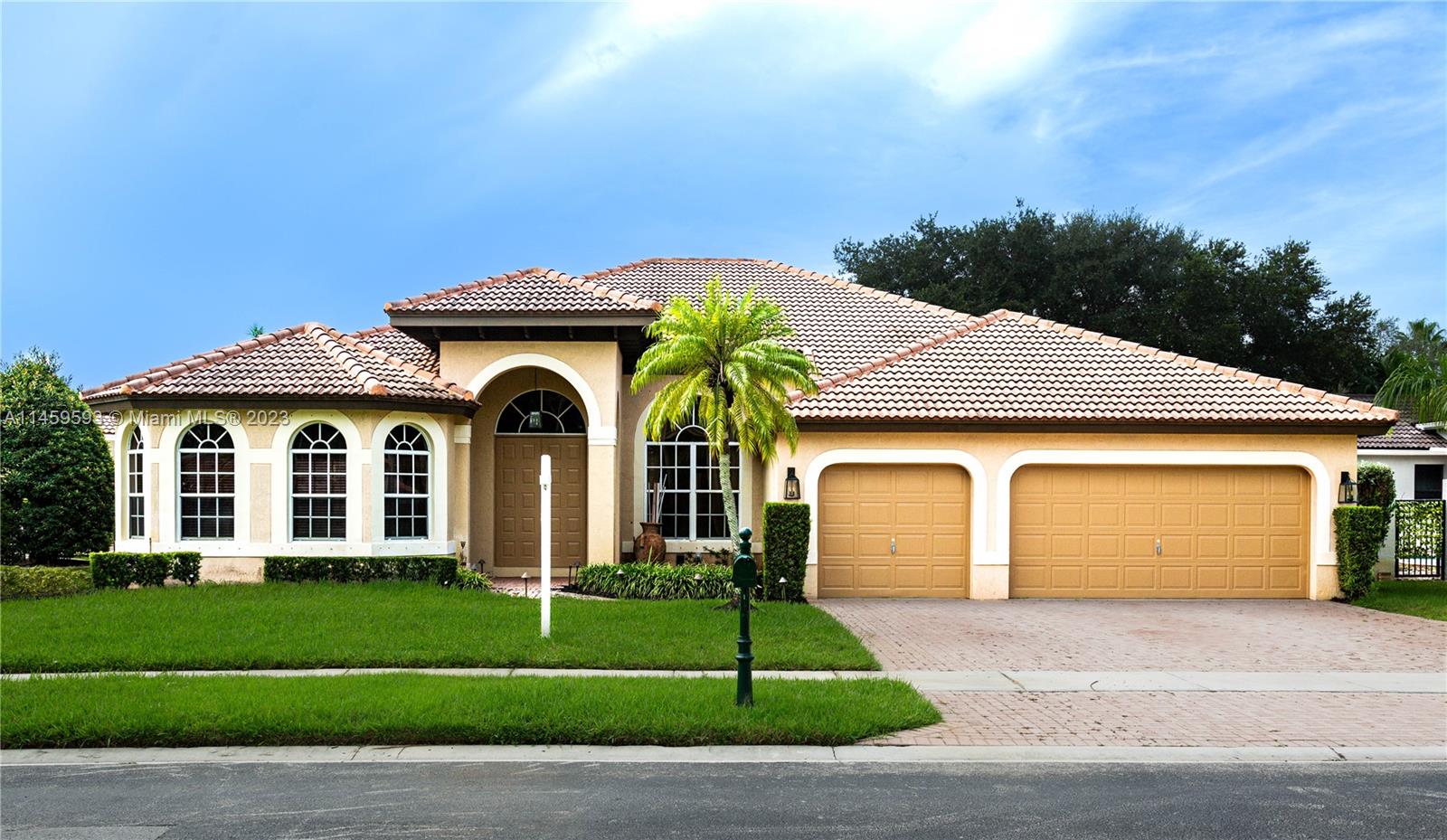 Sunset Lakes Miramar, FL 33029 - Photo 3 of 51 a front view of a house with a garden and plants