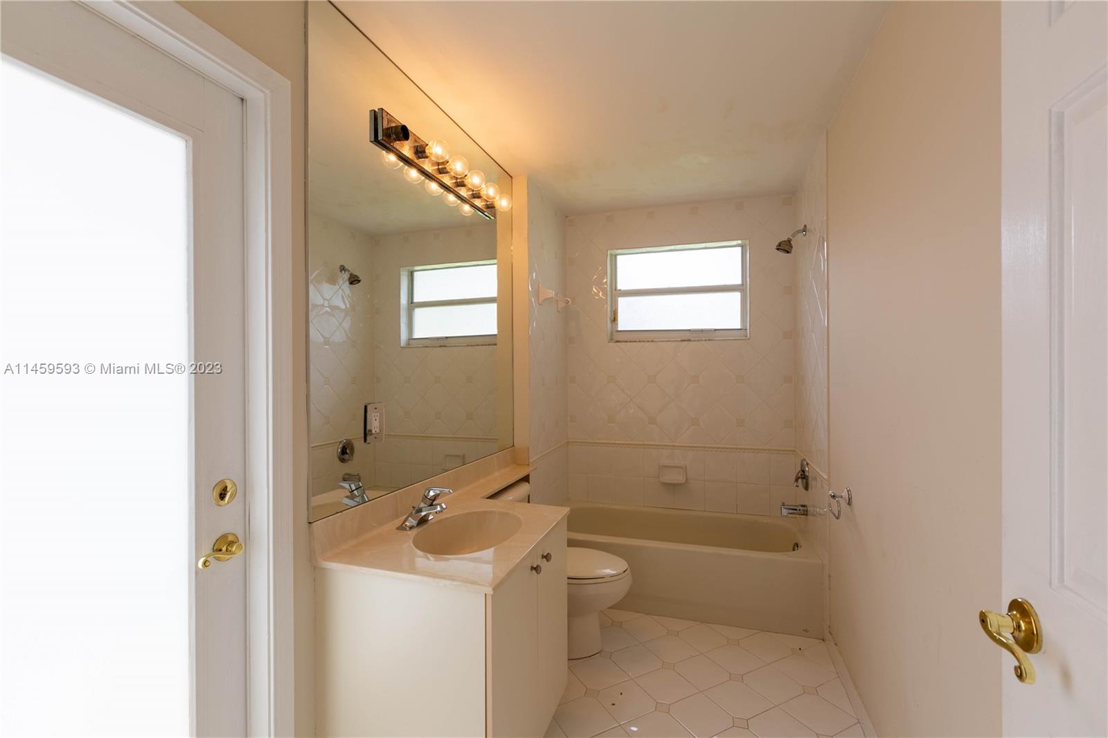 Sunset Lakes Miramar, FL 33029 - Photo 43 of 51 a bathroom with a sink a toilet and shower