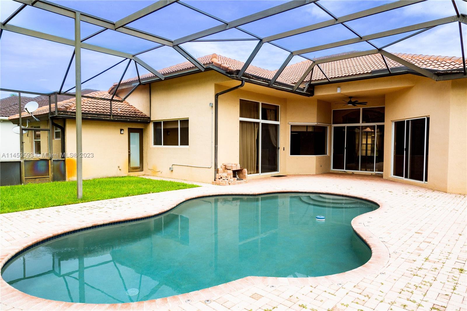 Sunset Lakes Miramar, FL 33029 - Photo 7 of 51 a swimming pool with an outdoor seating
