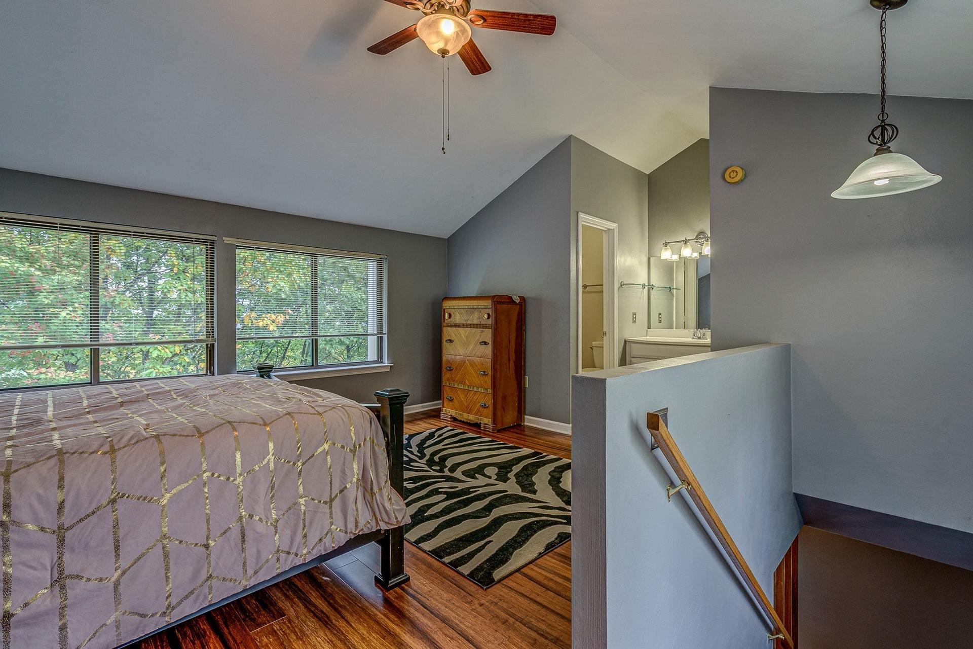 3269 Forest Ridge Road Roanoke, VA 24018 - Photo 11 of 14 a bed room with a bed window and a chandelier