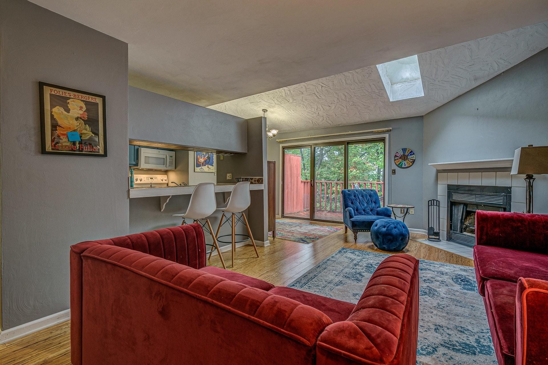 3269 Forest Ridge Road Roanoke, VA 24018 - Photo 3 of 14 a living room with furniture a large window and a fireplace
