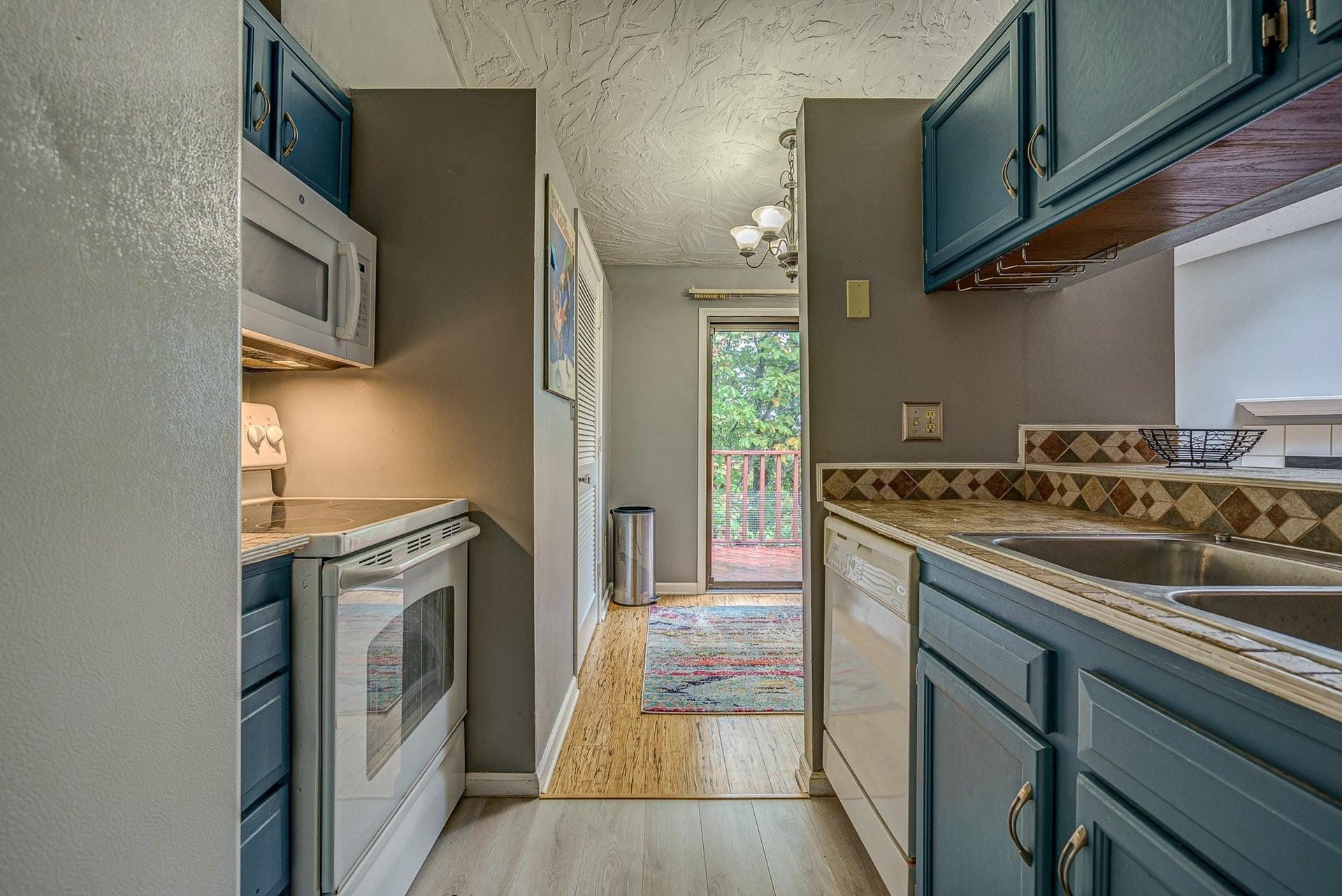 3269 Forest Ridge Road Roanoke, VA 24018 - Photo 10 of 14 a kitchen with a sink stove and refrigerator