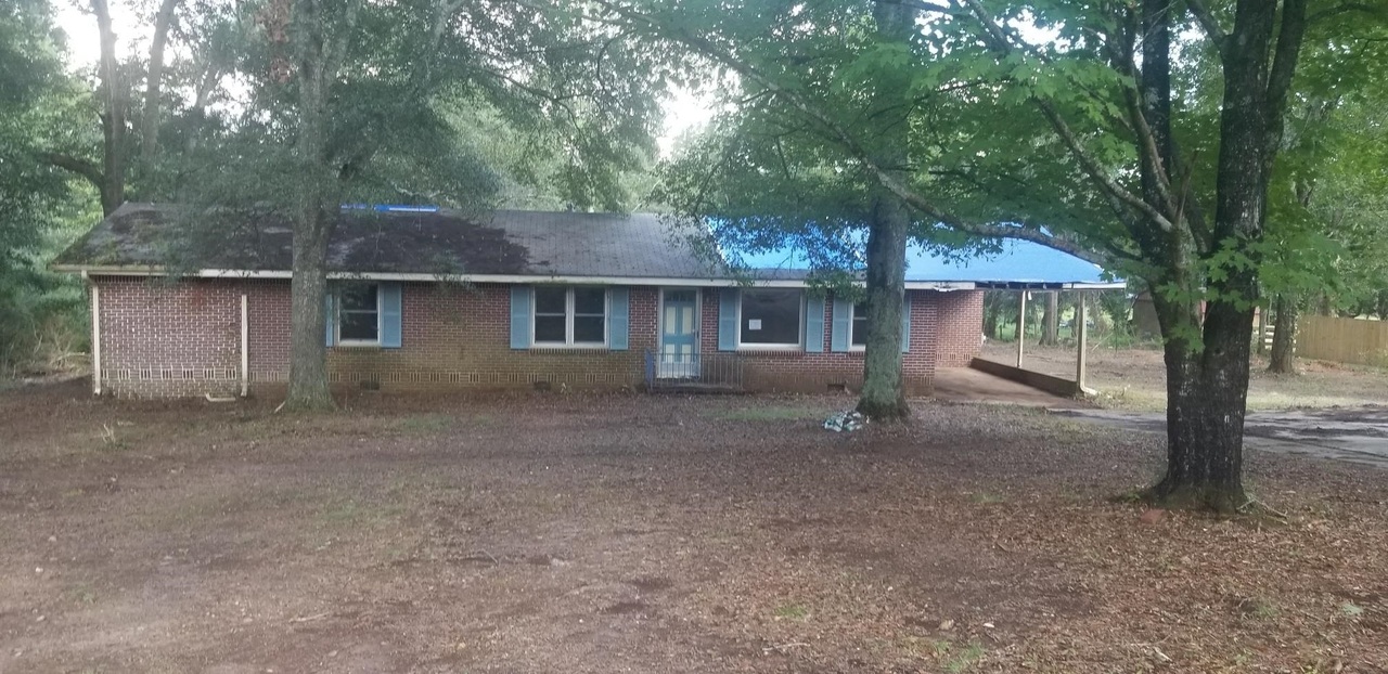 71 Canard Road Southeast Rome, GA 30161 - Photo 1 of 1 a view of a house with a backyard and a tree