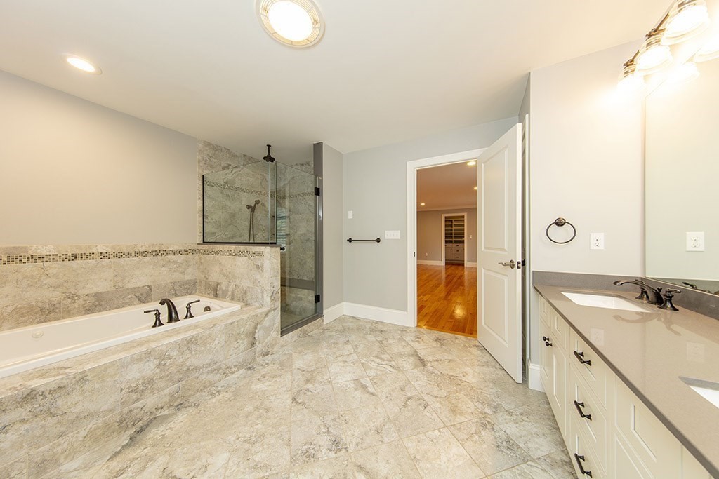 33 Liberty Avenue Lexington, MA 02420 - Photo 14 of 30 a spacious bathroom with a tub sink and mirror