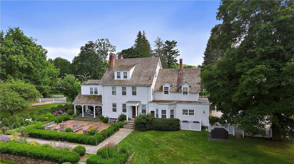 front view of a house with a garden