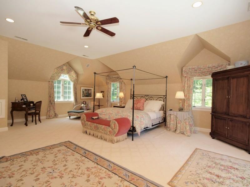 284 Hawks Hill Road New Canaan, CT 06840 - Photo 11 of 23 a bedroom with furniture and a chandelier