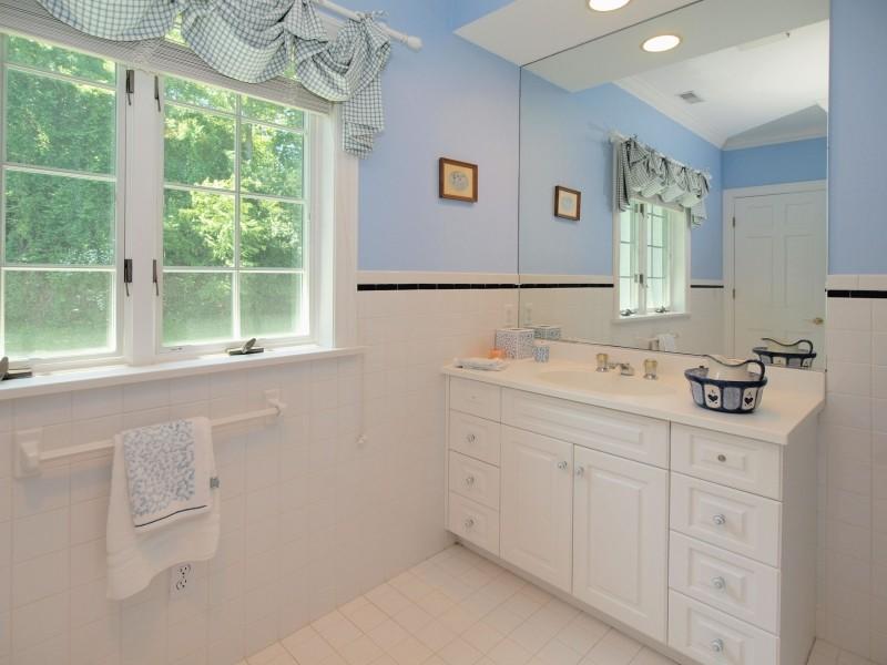 284 Hawks Hill Road New Canaan, CT 06840 - Photo 15 of 23 a bathroom with a sink and a window