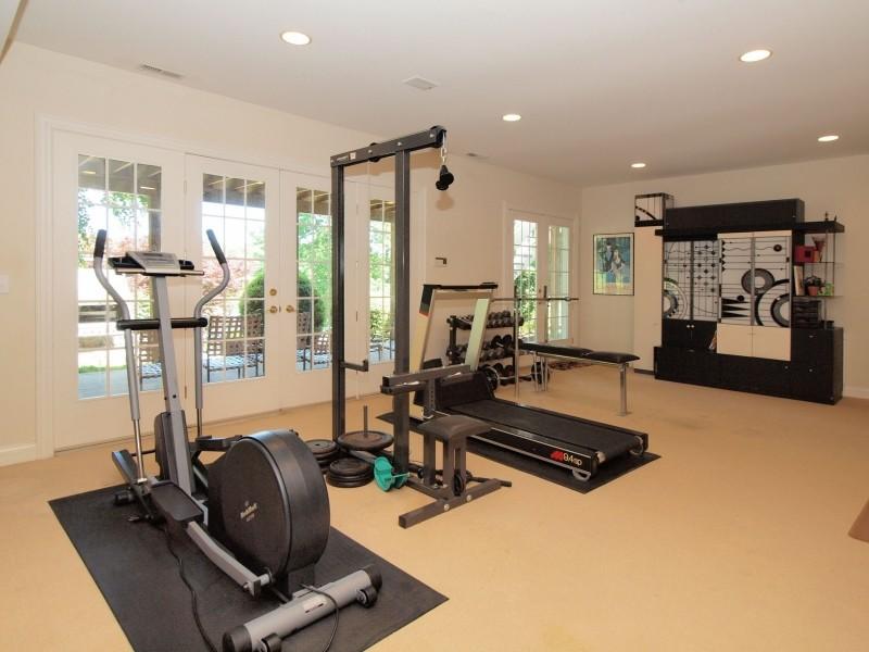 284 Hawks Hill Road New Canaan, CT 06840 - Photo 19 of 23 a room with gym equipment and a large window
