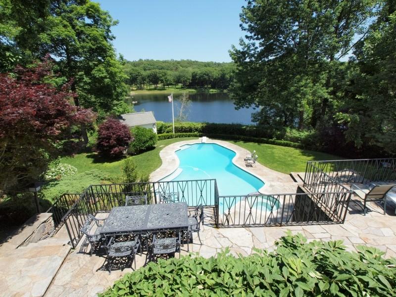 284 Hawks Hill Road New Canaan, CT 06840 - Photo 20 of 23 an outdoor space with seating area and lake view
