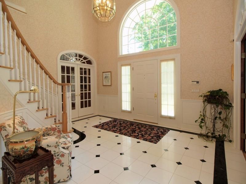 284 Hawks Hill Road New Canaan, CT 06840 - Photo 2 of 23 a view of a livingroom with wooden floor and a large window
