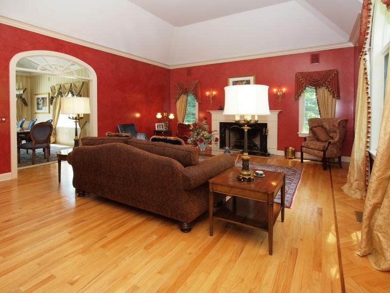 284 Hawks Hill Road New Canaan, CT 06840 - Photo 3 of 23 a living room with furniture a fireplace and a dining table with wooden floor