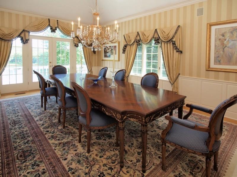 284 Hawks Hill Road New Canaan, CT 06840 - Photo 8 of 23 a view of a dining room with furniture and chandelier