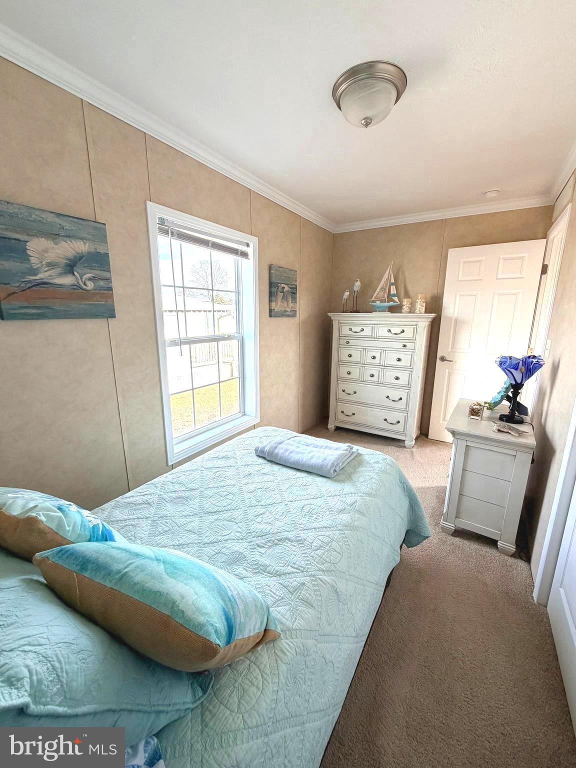 38025 Rabbit Road, Unit 101 Ocean View, DE 19970 - Photo 63 of 112 a bedroom with a bed and wooden floor