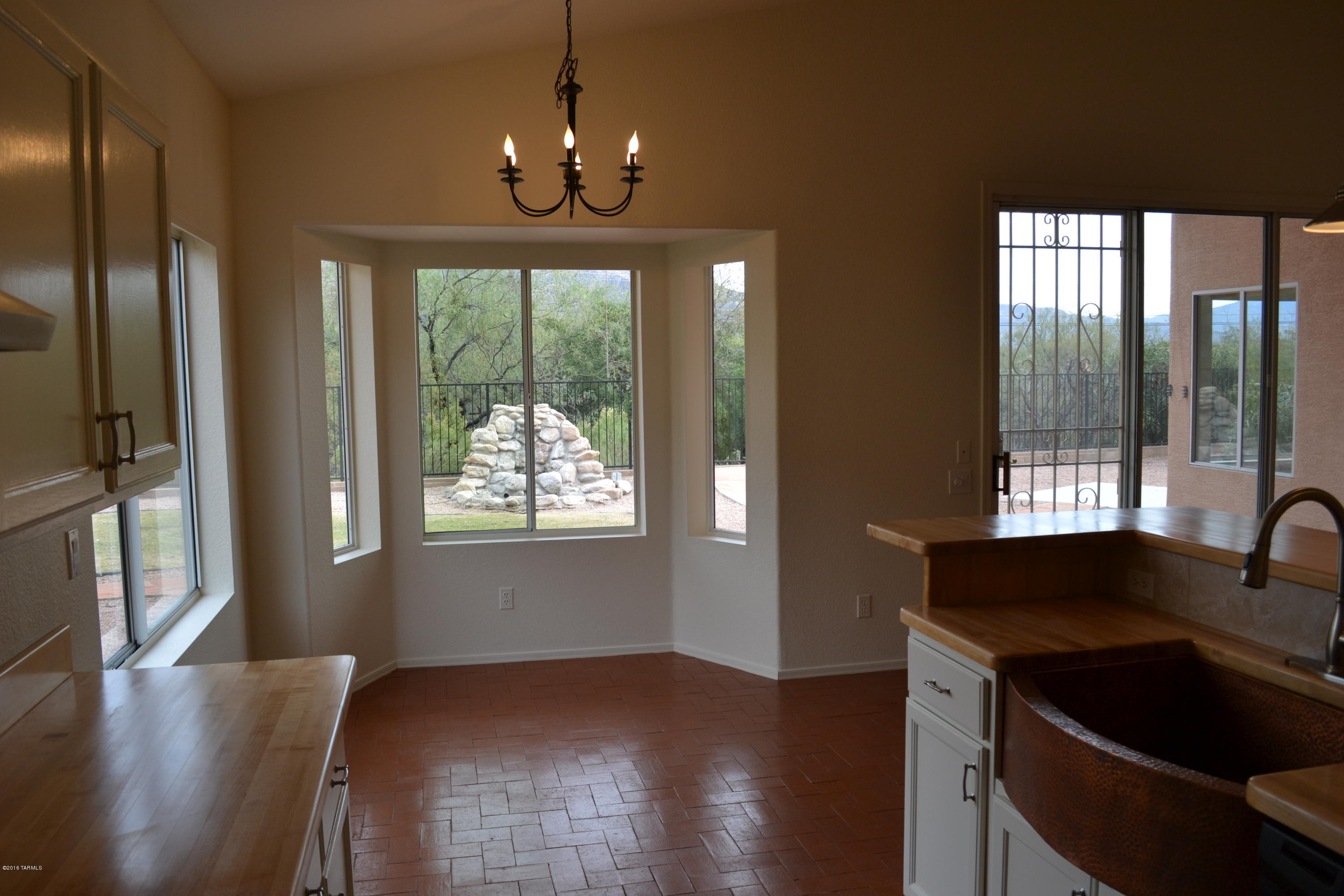 5640 North Cherokee Ridge Road Tucson, AZ 85750 - Photo 11 of 39 a kitchen with granite countertop sink stove and refrigerator