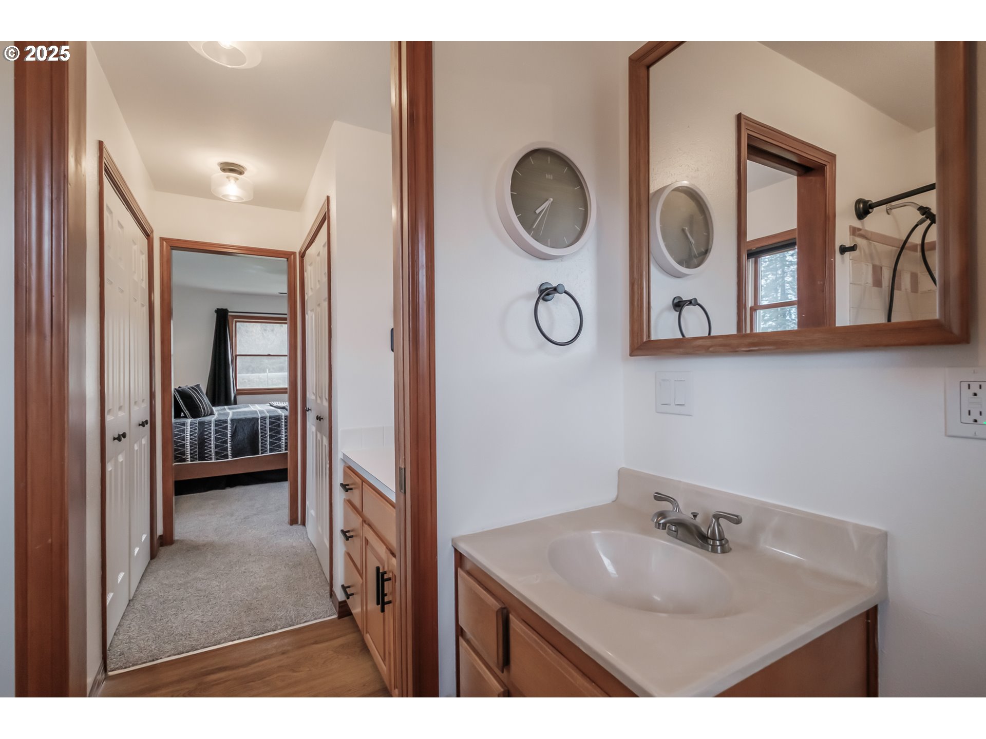 15105 Orchard Knob Road Dallas, OR 97338 - Photo 23 of 48 a bathroom with a sink a mirror and a toilet