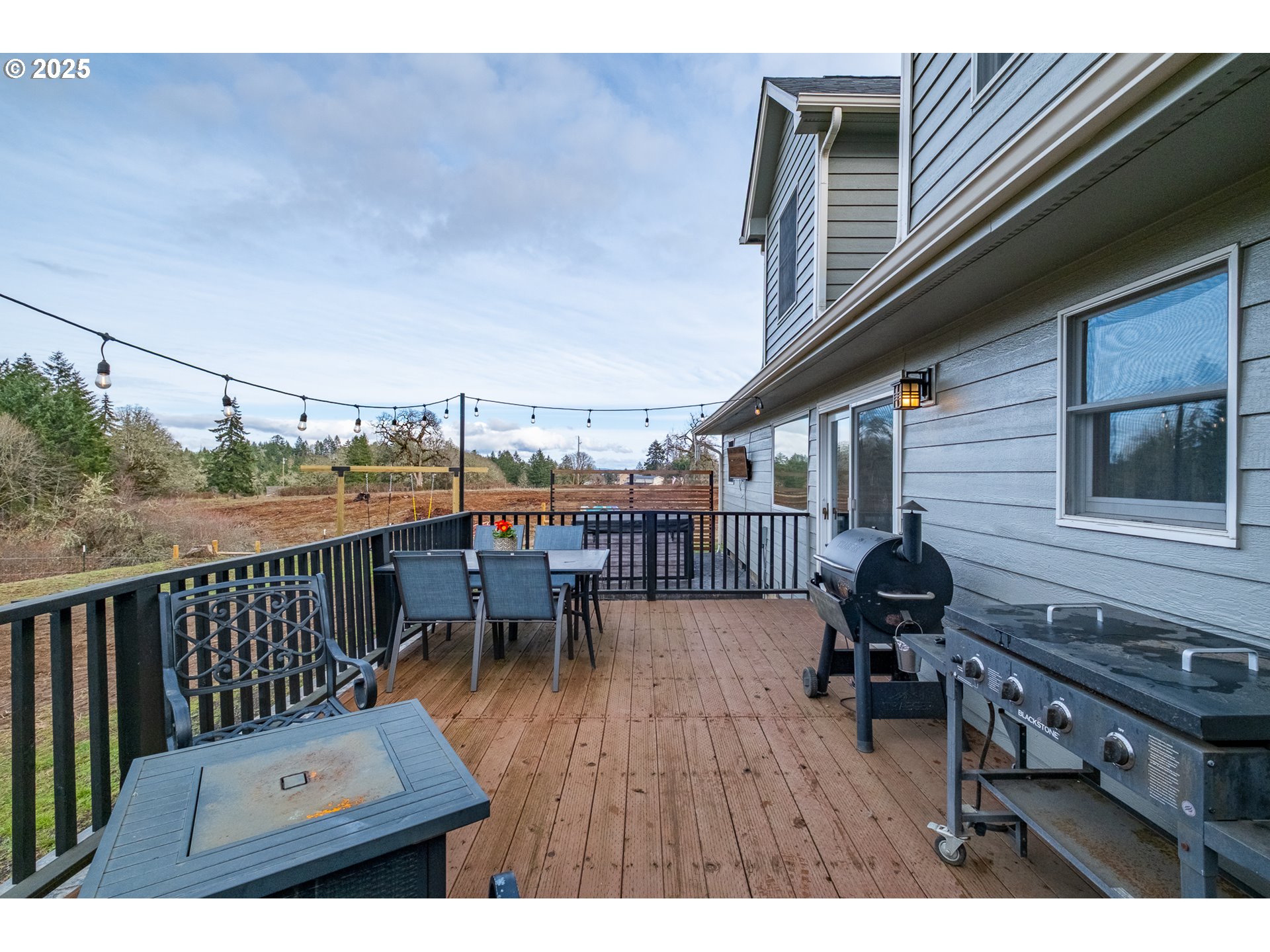 15105 Orchard Knob Road Dallas, OR 97338 - Photo 38 of 48 a view of a roof deck with table and chairs
