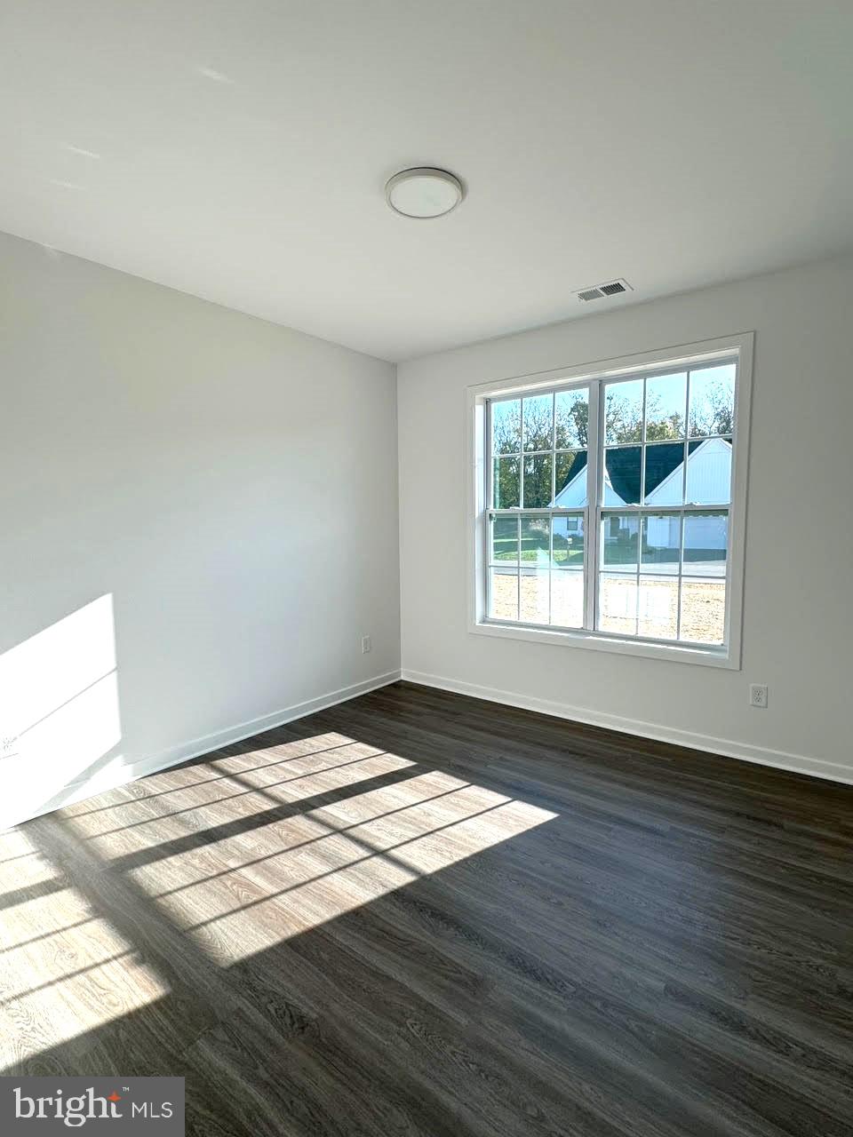 Tbd Tbd Glenaire Road Bunker Hill, WV 25413 - Photo 20 of 23 a view of an empty room with wooden floor and a window