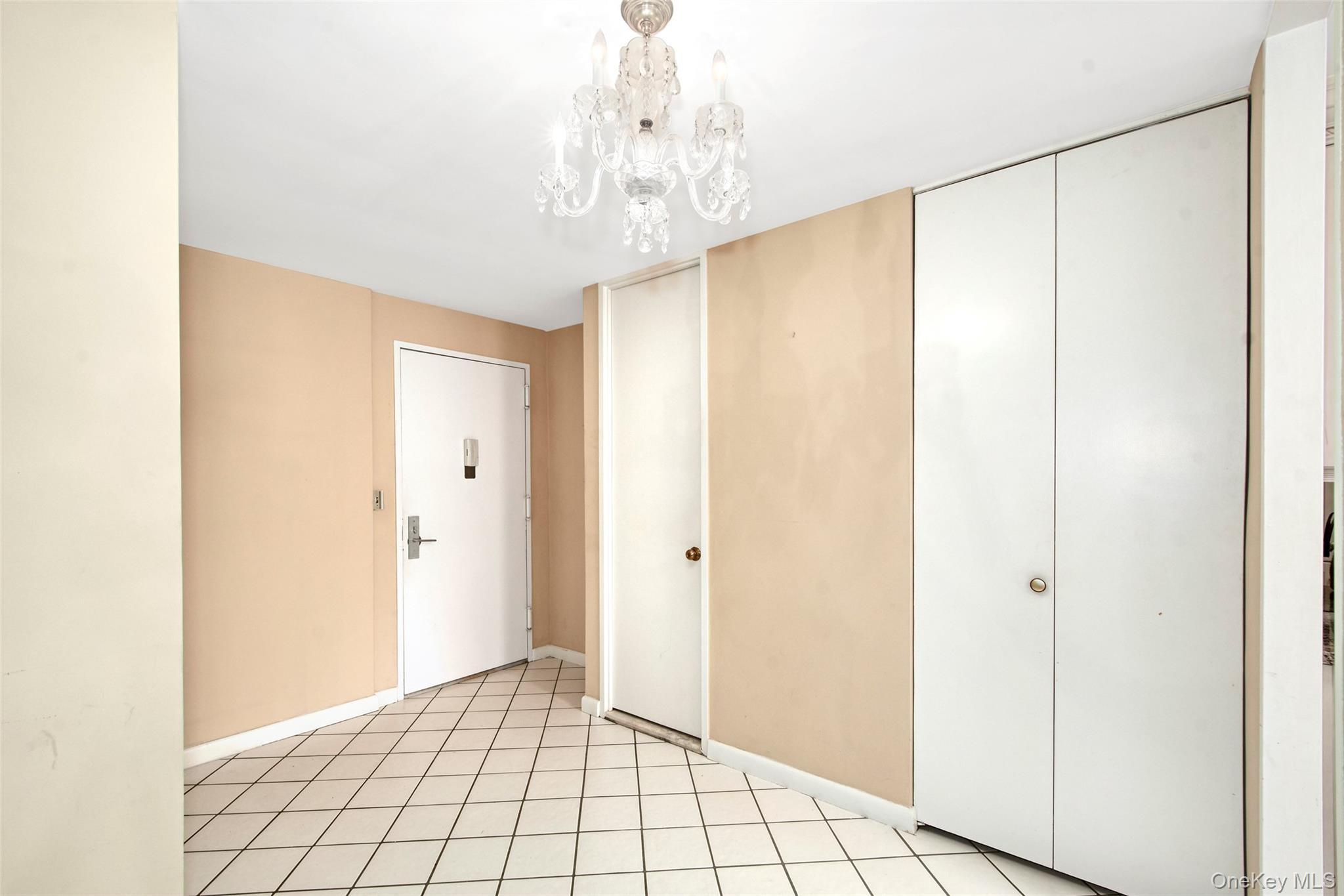 720 Milton Road, Unit WEST BUILDING 2E Rye, NY 10580 - Photo 2 of 19 Foyer w/Powder Room and large closet