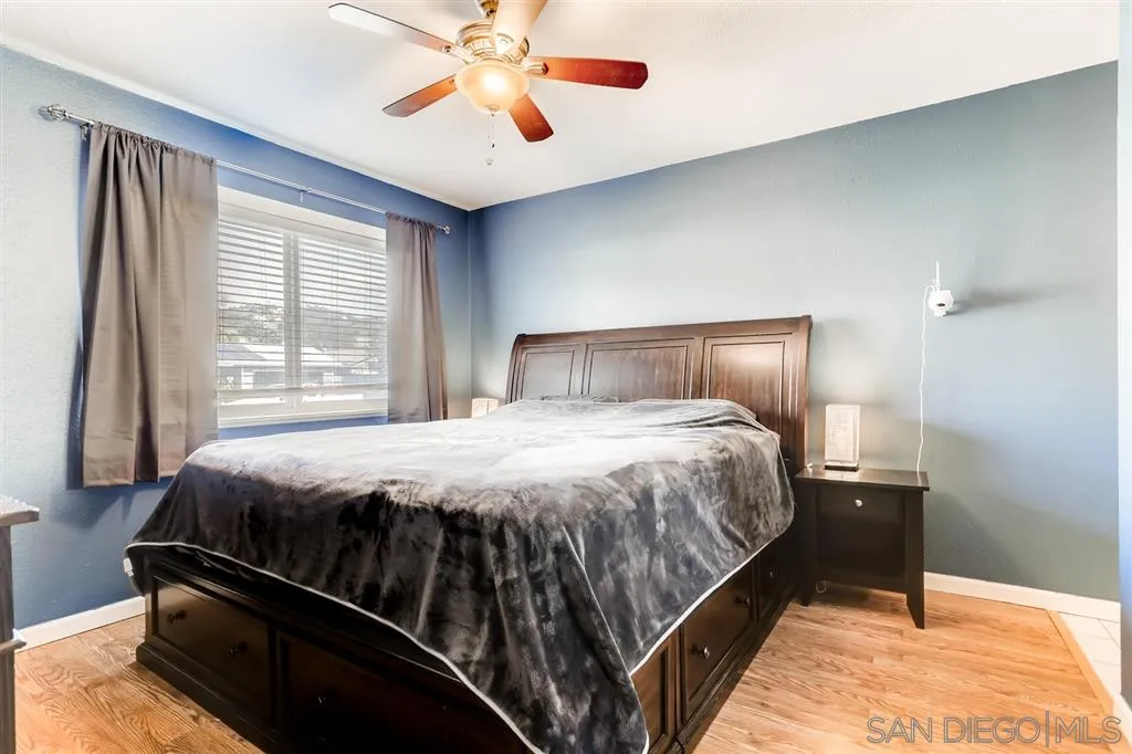 13131 Chrissy Way Lakeside, CA 92040 - Photo 17 of 25 a bed sitting in a bedroom next to a window