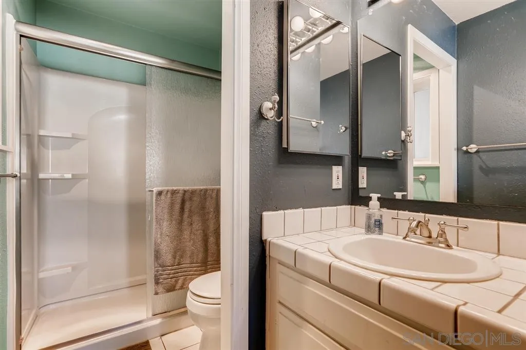13131 Chrissy Way Lakeside, CA 92040 - Photo 18 of 25 a bathroom with a granite countertop sink toilet and shower