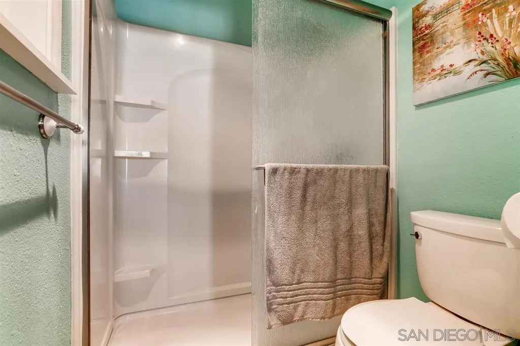 13131 Chrissy Way Lakeside, CA 92040 - Photo 19 of 25 a white toilet sitting next to a shower
