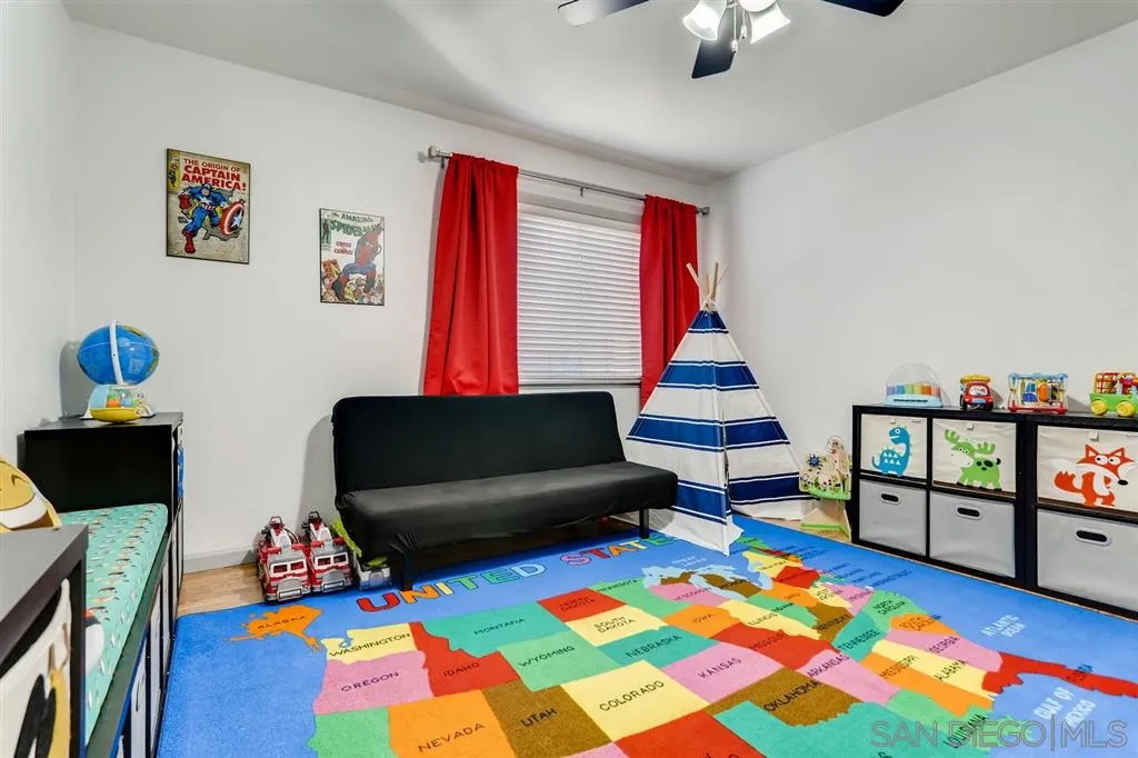 13131 Chrissy Way Lakeside, CA 92040 - Photo 5 of 25 a living room with furniture and a baby crib
