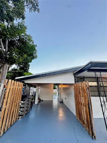 a kitchen with stainless steel appliances granite countertop a stove top oven a sink a refrigerator and a granite counter tops